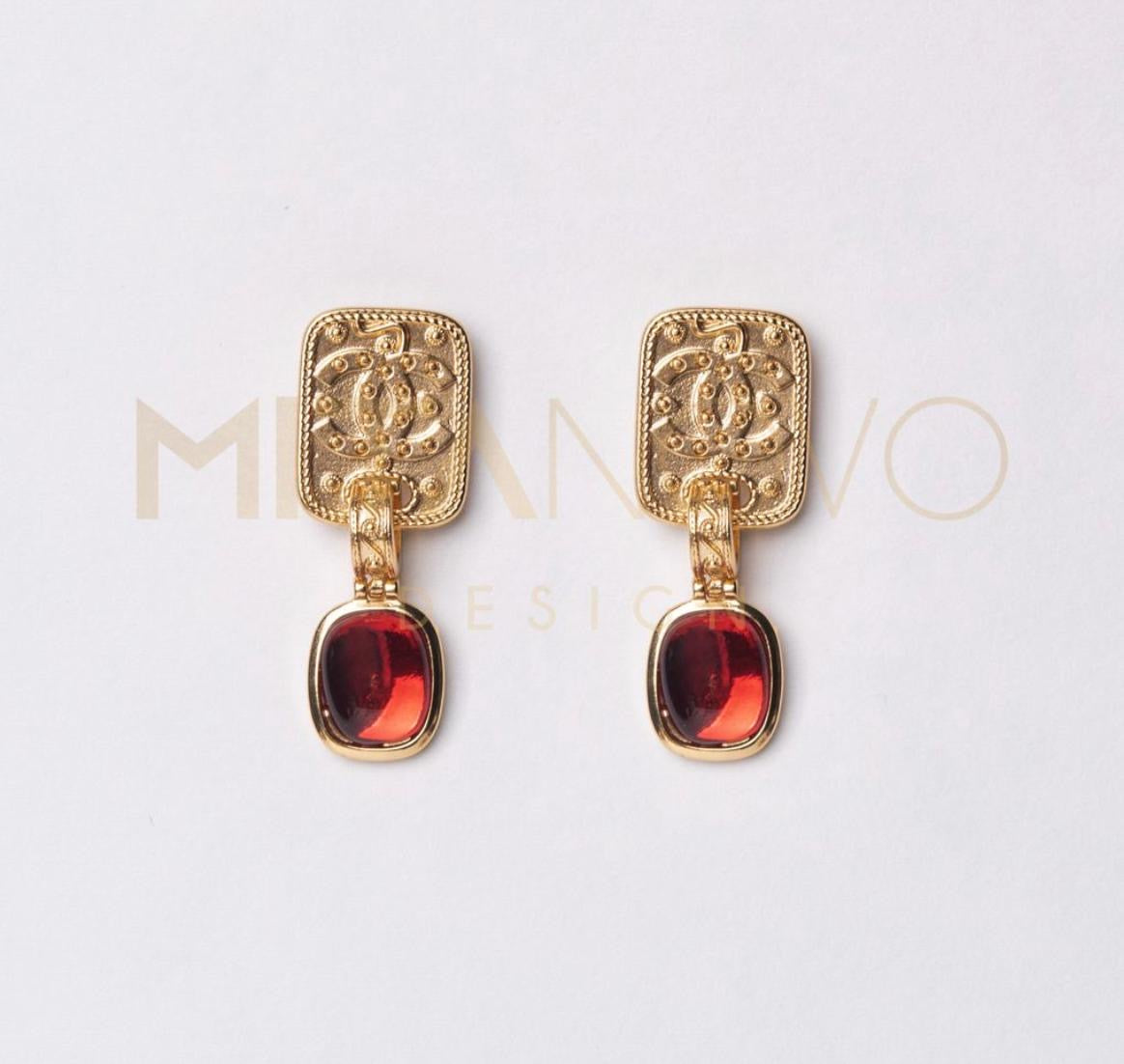 Golden earrings with gem