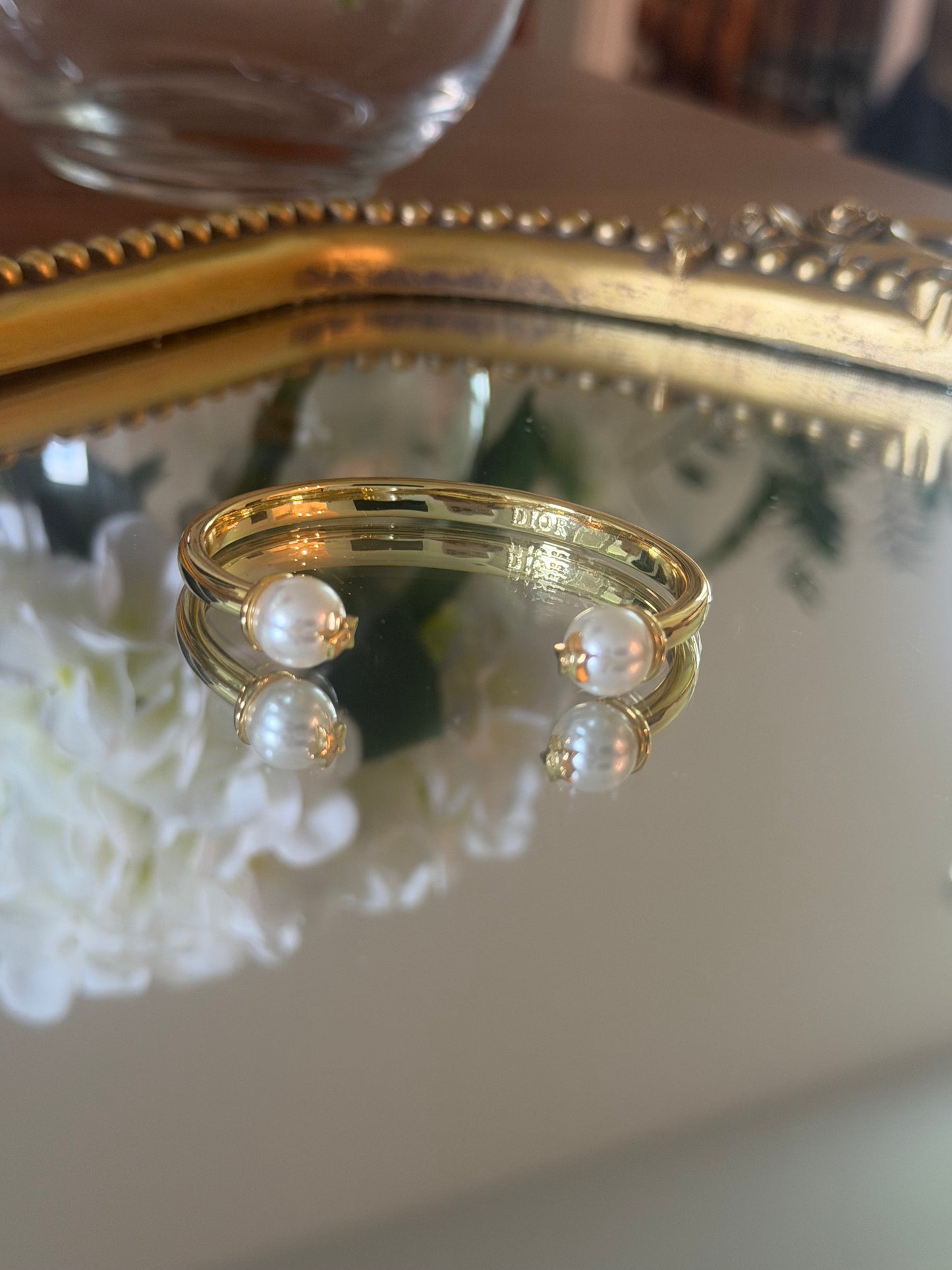 Gold cuff bracelet with pearl
