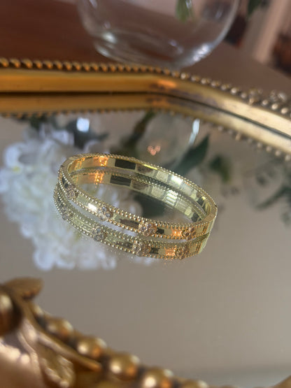 Gold bracelet with stone