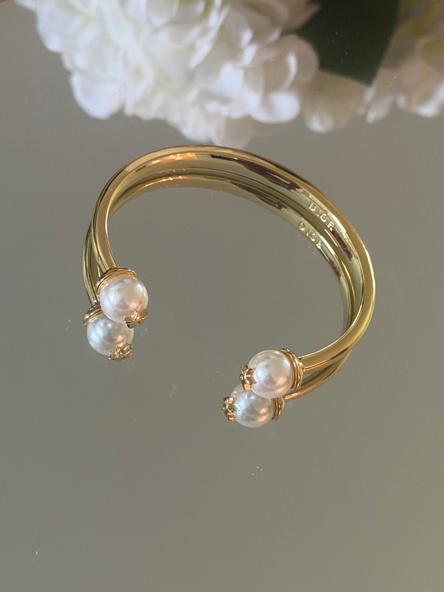 Gold cuff bracelet with pearl