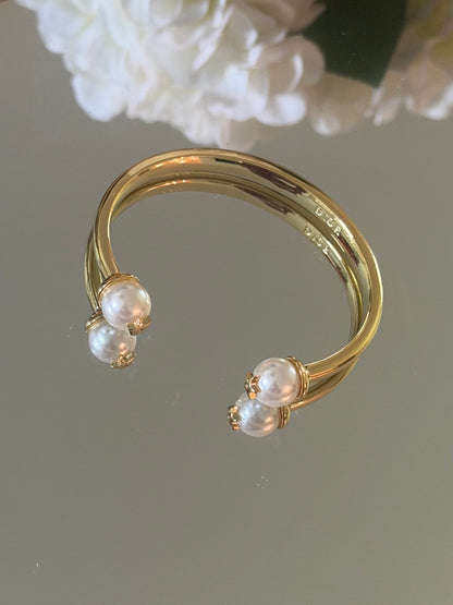 Gold cuff bracelet with pearl