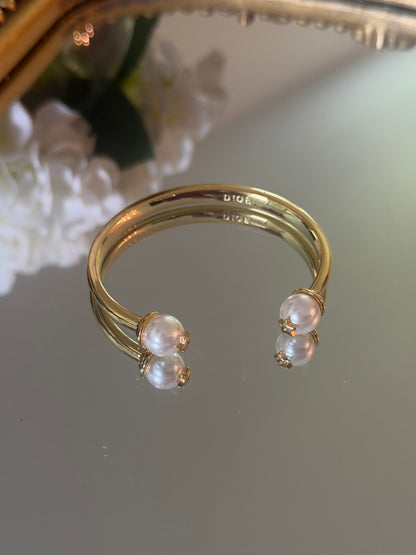 Gold cuff bracelet with pearl