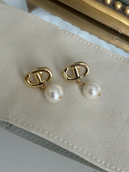 Gold Dangling Pearl Earrings
