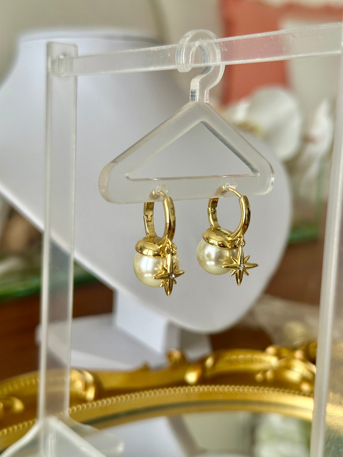 Dangling pearl earrings