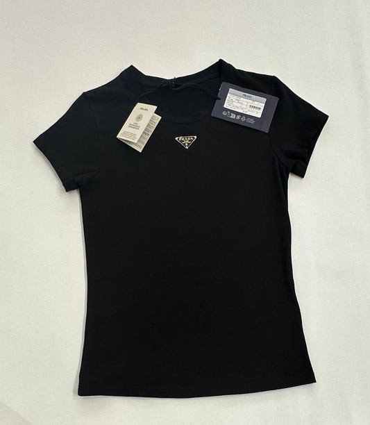 Black t-shirt with a brand logo and tags on a light gray background
