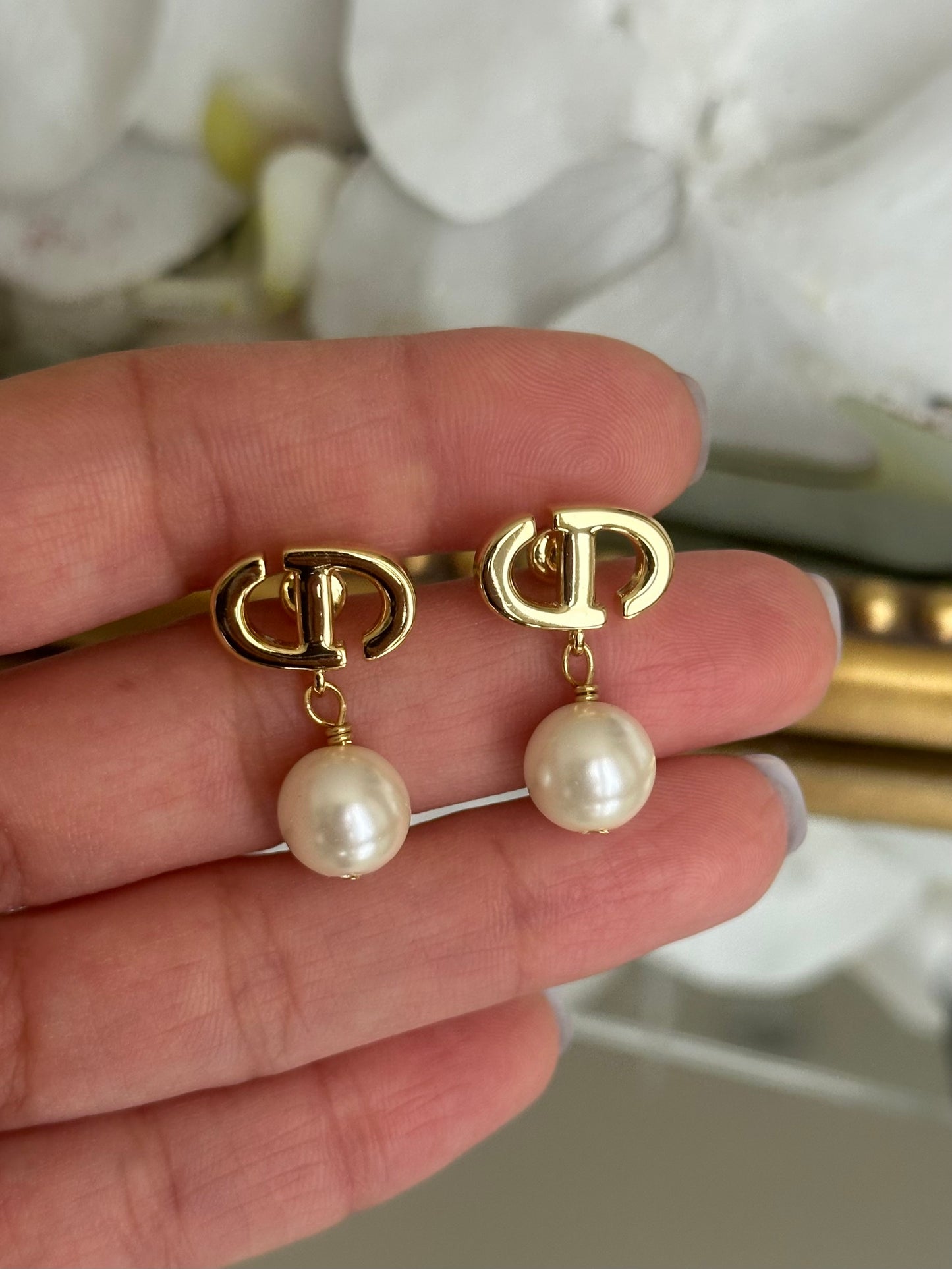 Gold Dangling Pearl Earrings